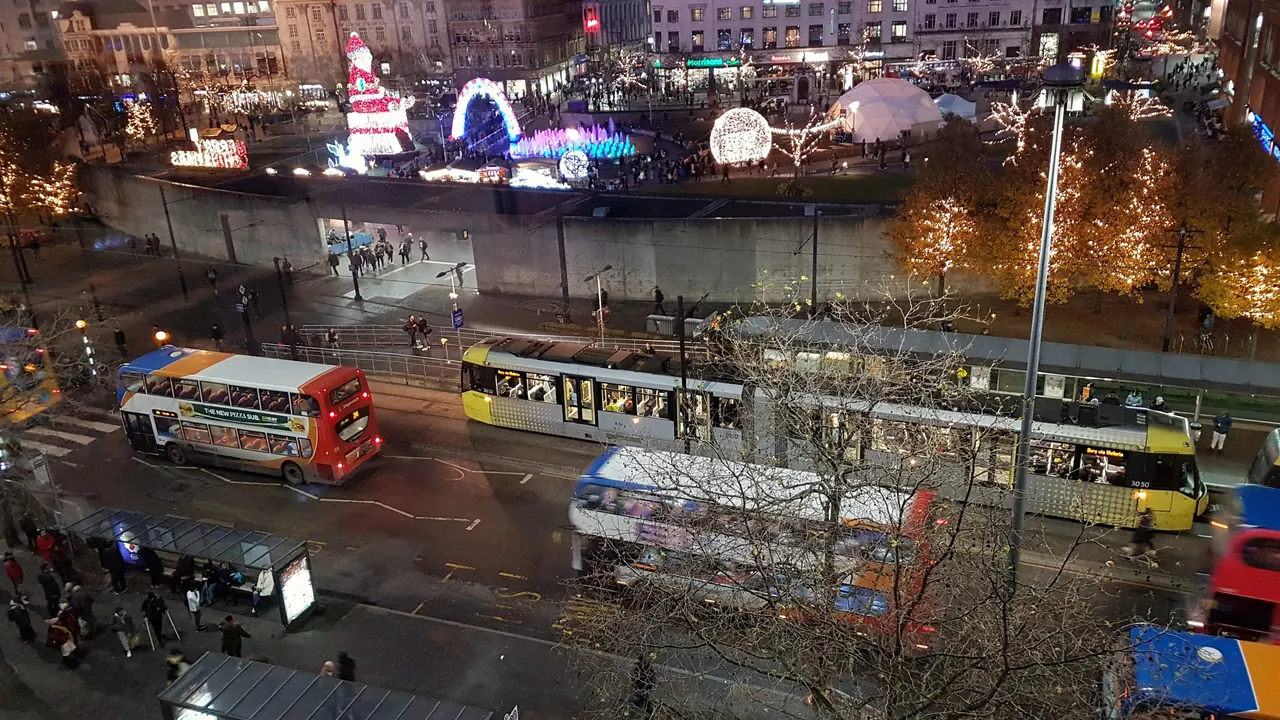 Piccadilly Gardens at night, a short walk away